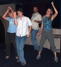 Robert, Steve G, Michael, and Sarah dancing at Harpers